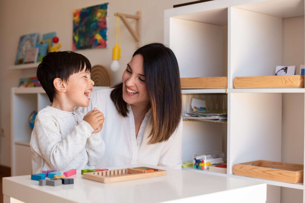 Children playing with therapy materials